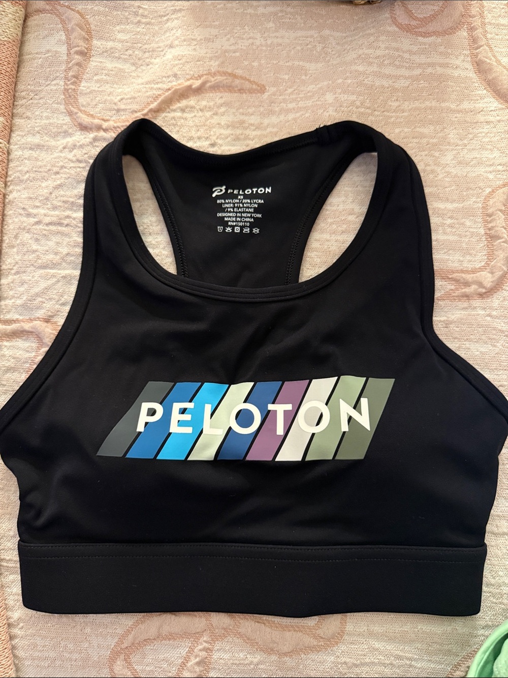 Peloton Black Sports Bra with Blue, Purple & Green Stripe Logo